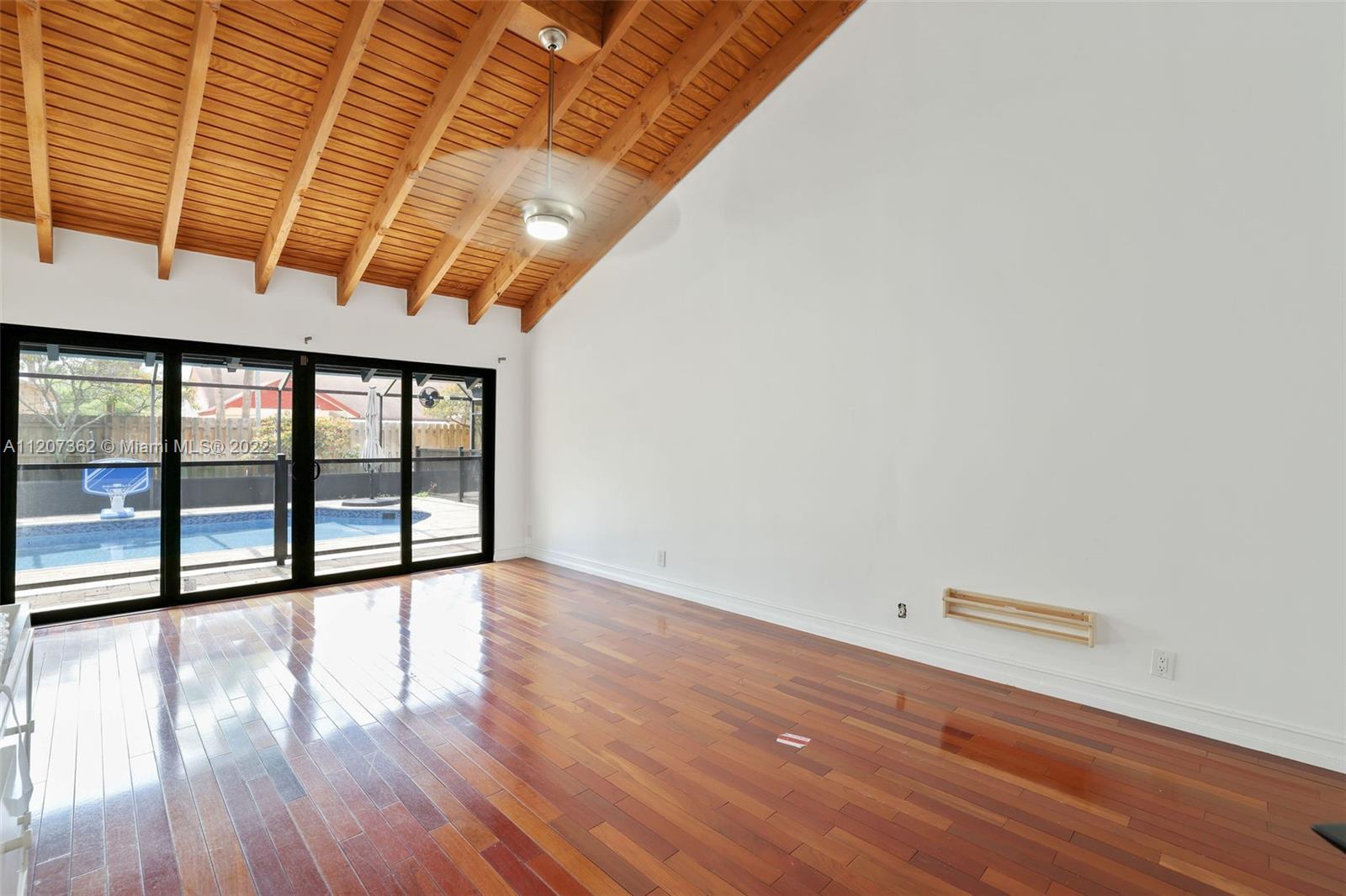 1501 Northwest 12th Terrace Boca Raton, FL 33486 - Photo 20 of 49 wooden floor in an empty room