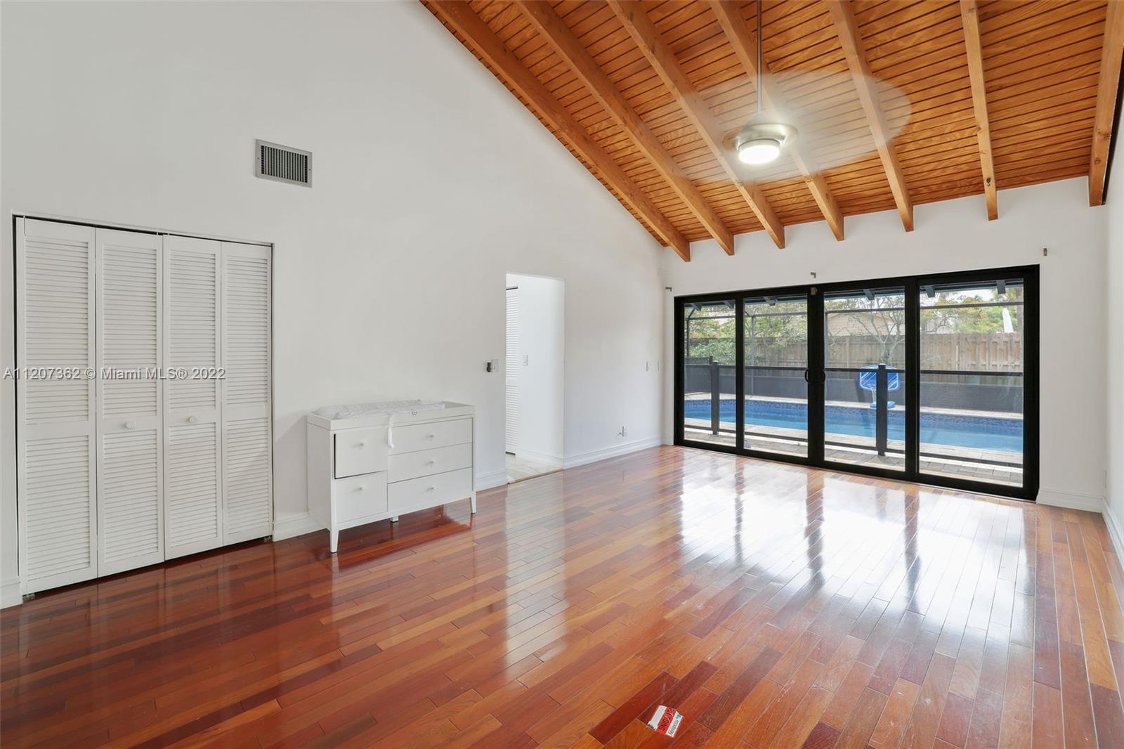1501 Northwest 12th Terrace Boca Raton, FL 33486 - Photo 21 of 49 a view of a room with wooden floor
