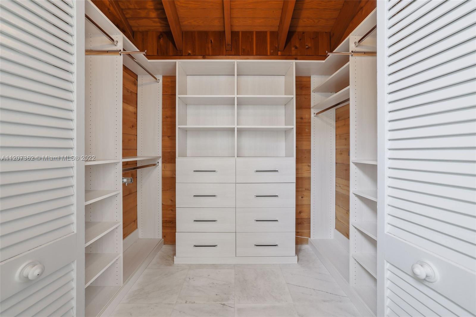 1501 Northwest 12th Terrace Boca Raton, FL 33486 - Photo 22 of 49 a view of walk in closet and bedroom