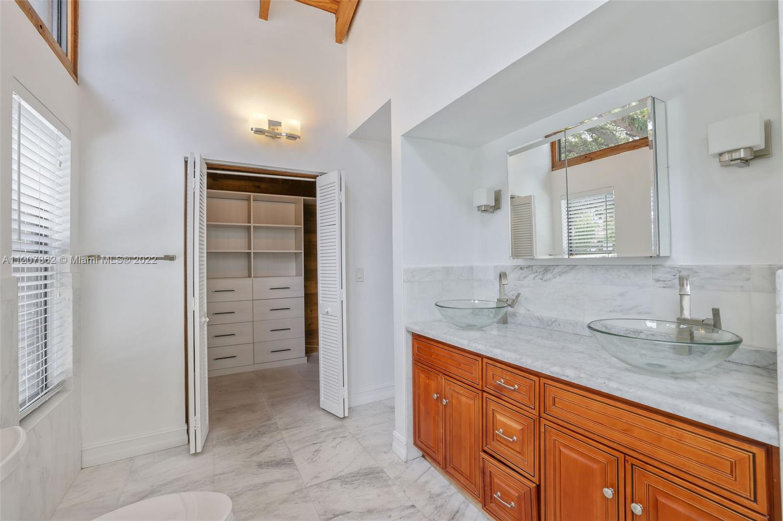 1501 Northwest 12th Terrace Boca Raton, FL 33486 - Photo 24 of 49 a bathroom with a granite countertop sink and a mirror