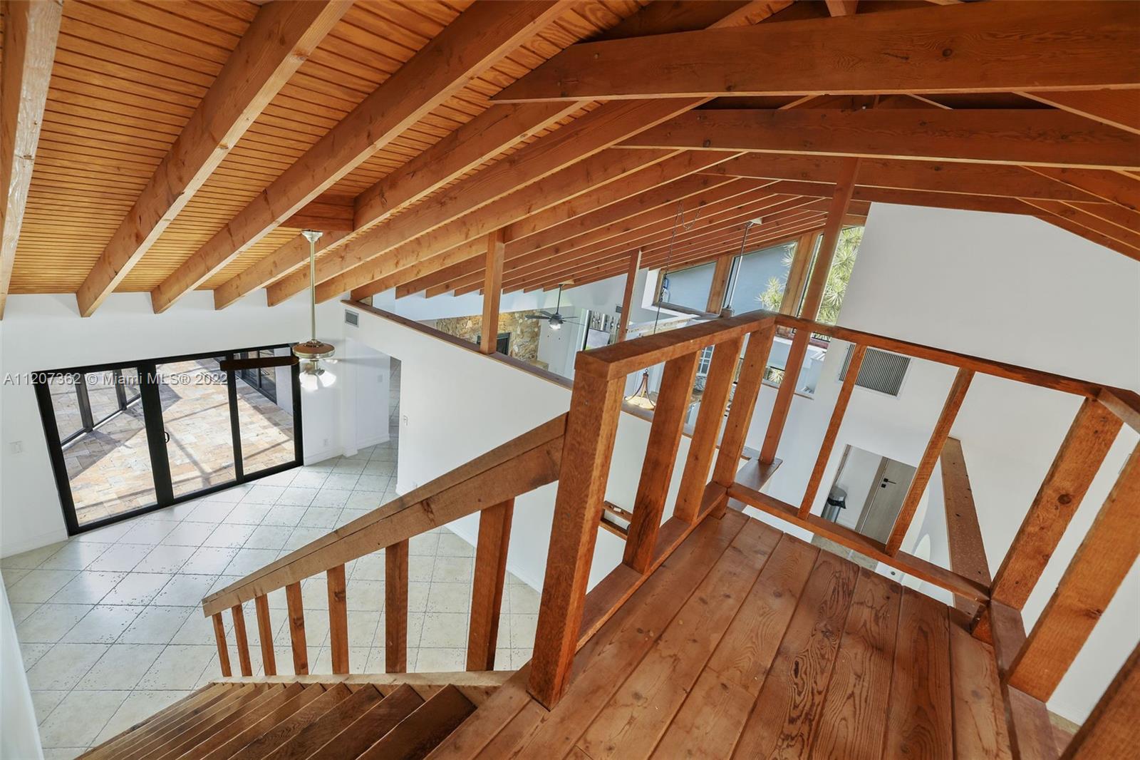 1501 Northwest 12th Terrace Boca Raton, FL 33486 - Photo 29 of 49 a view of staircase with railing and white walls