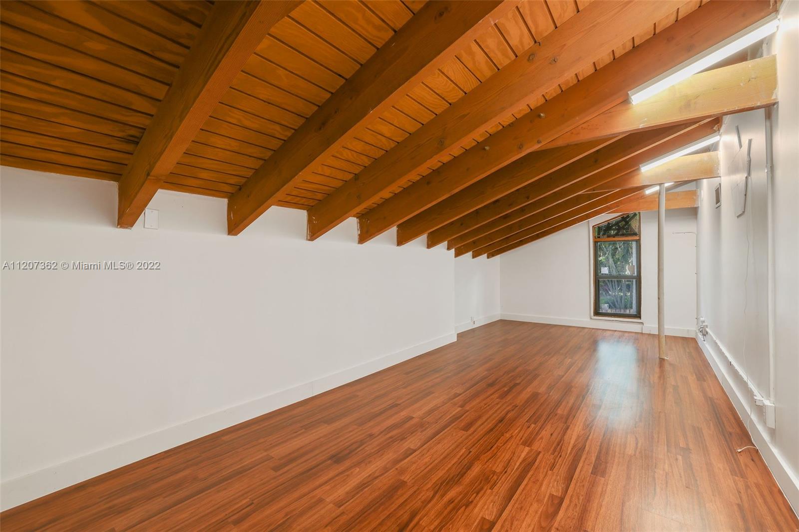 1501 Northwest 12th Terrace Boca Raton, FL 33486 - Photo 30 of 49 a view of empty room with wooden floor