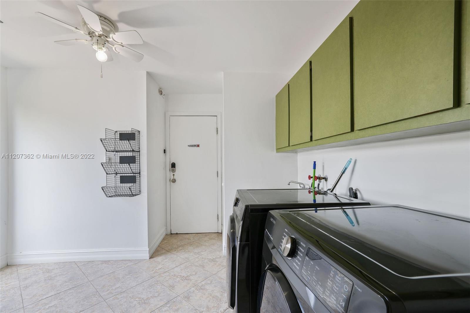 1501 Northwest 12th Terrace Boca Raton, FL 33486 - Photo 31 of 49 a kitchen with a sink and cabinets