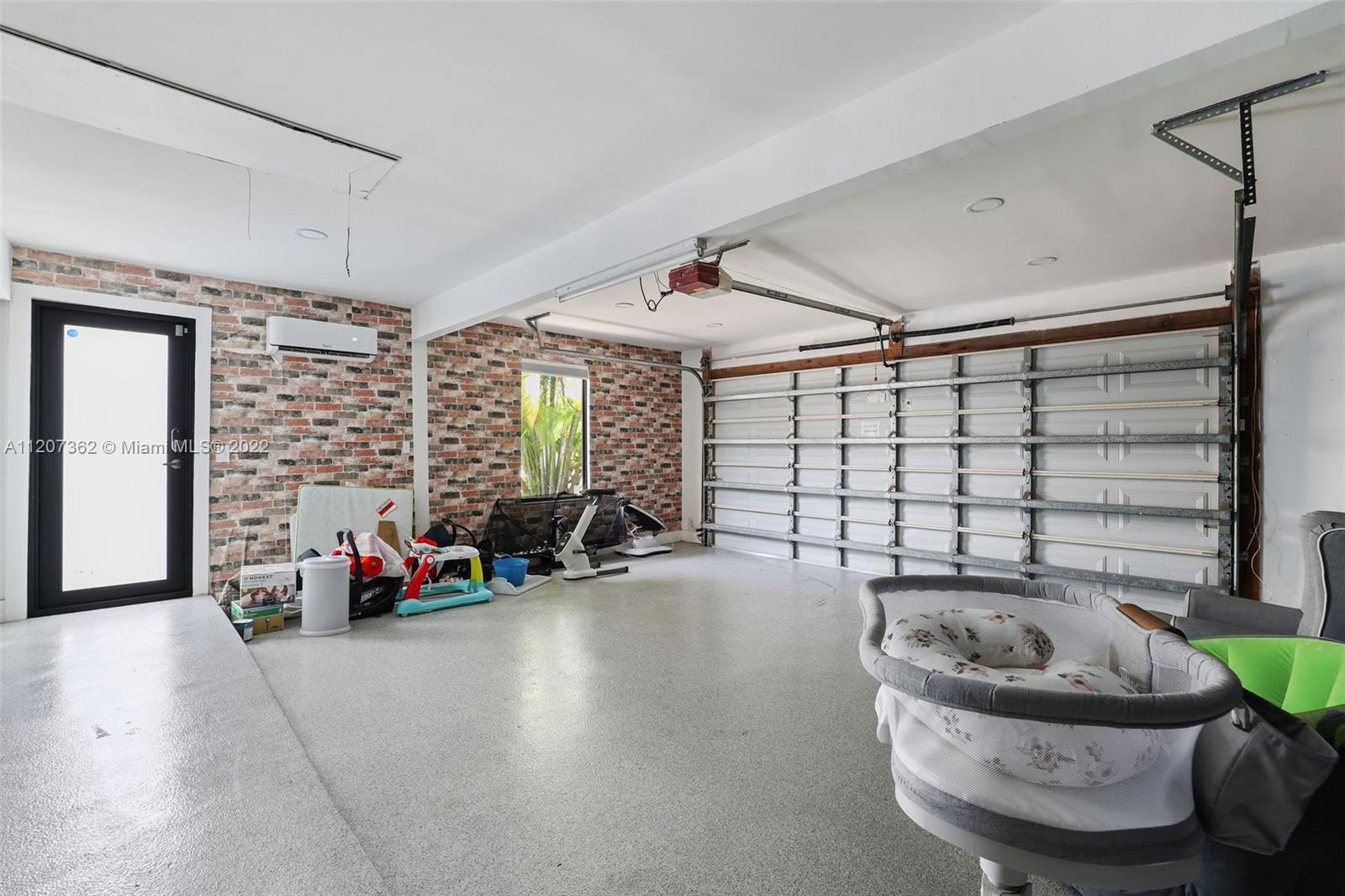 1501 Northwest 12th Terrace Boca Raton, FL 33486 - Photo 32 of 49 a living room with furniture and a large window