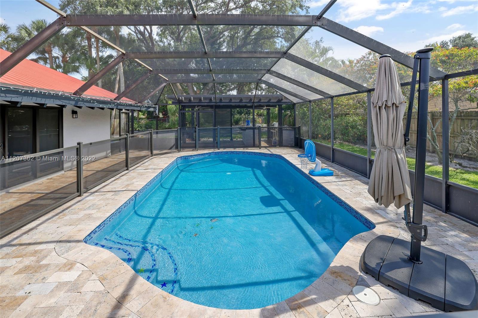 1501 Northwest 12th Terrace Boca Raton, FL 33486 - Photo 33 of 49 a view of a swimming pool with a patio