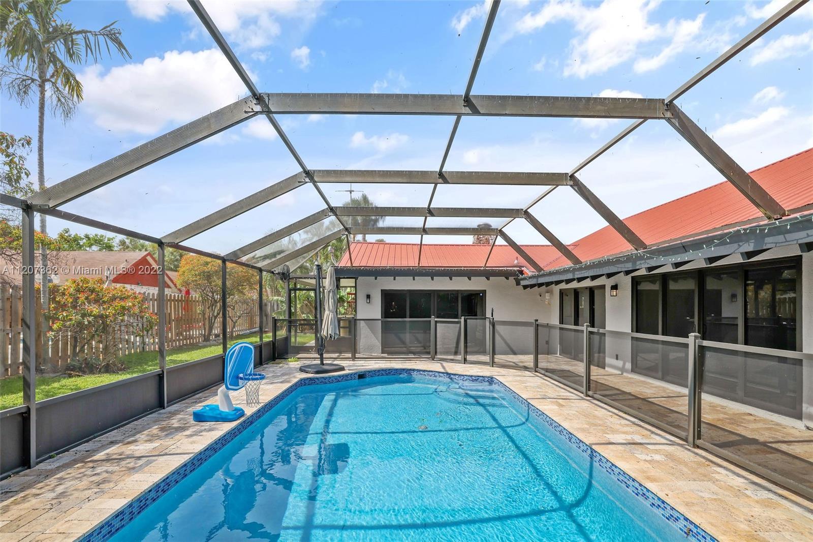 1501 Northwest 12th Terrace Boca Raton, FL 33486 - Photo 35 of 49 a view of a swimming pool with a porch