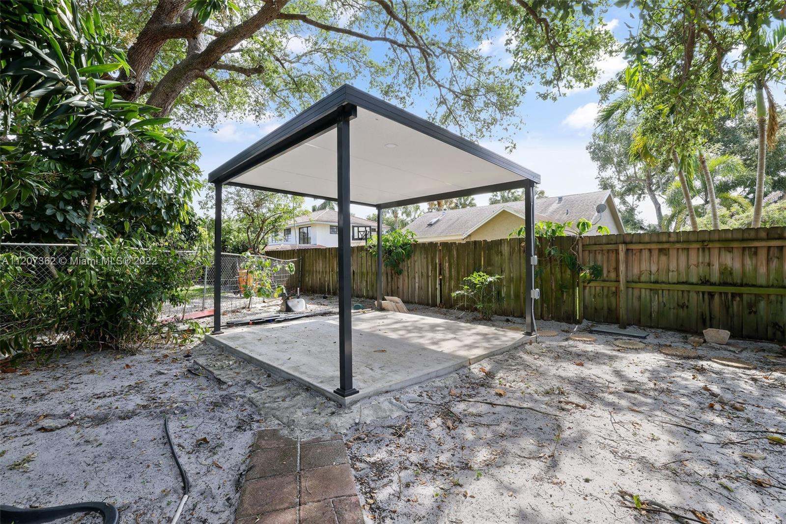 1501 Northwest 12th Terrace Boca Raton, FL 33486 - Photo 40 of 49 a backyard of a house with a tree