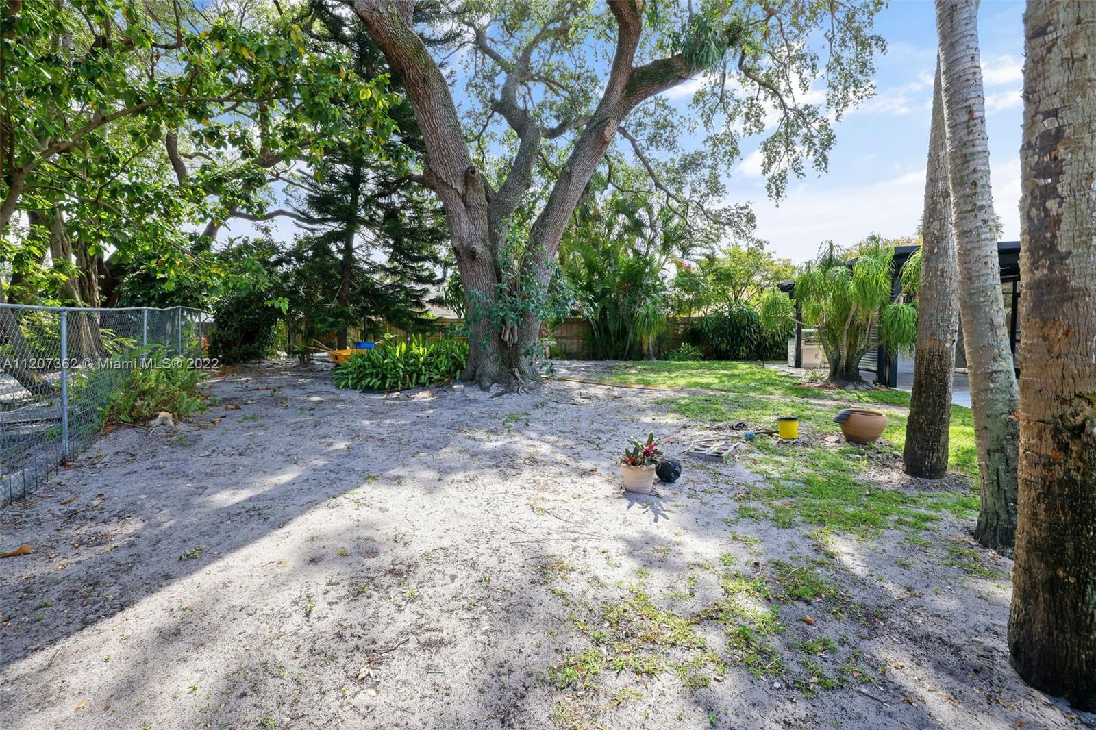 1501 Northwest 12th Terrace Boca Raton, FL 33486 - Photo 44 of 49 a view of a yard with a tree