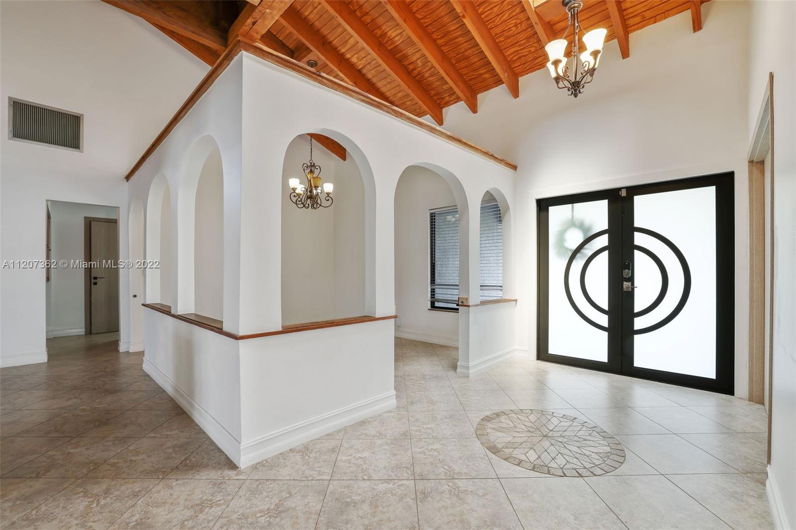1501 Northwest 12th Terrace Boca Raton, FL 33486 - Photo 5 of 49 a view of a hallway with washer and dryer