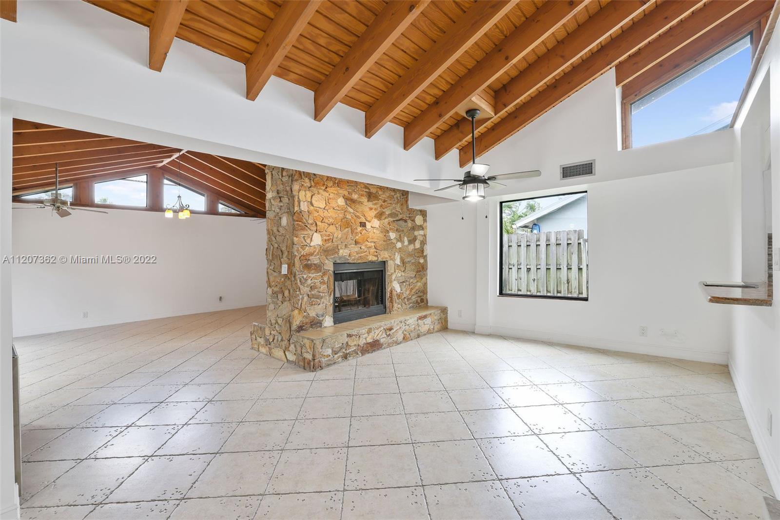 1501 Northwest 12th Terrace Boca Raton, FL 33486 - Photo 10 of 49 a view of an empty room with a window