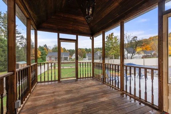 a view of a balcony with wooden floor