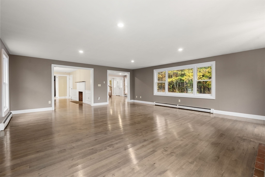 163 South Shelburne Road Greenfield, MA 01301 - Photo 5 of 36 an empty room with wooden floor and windows