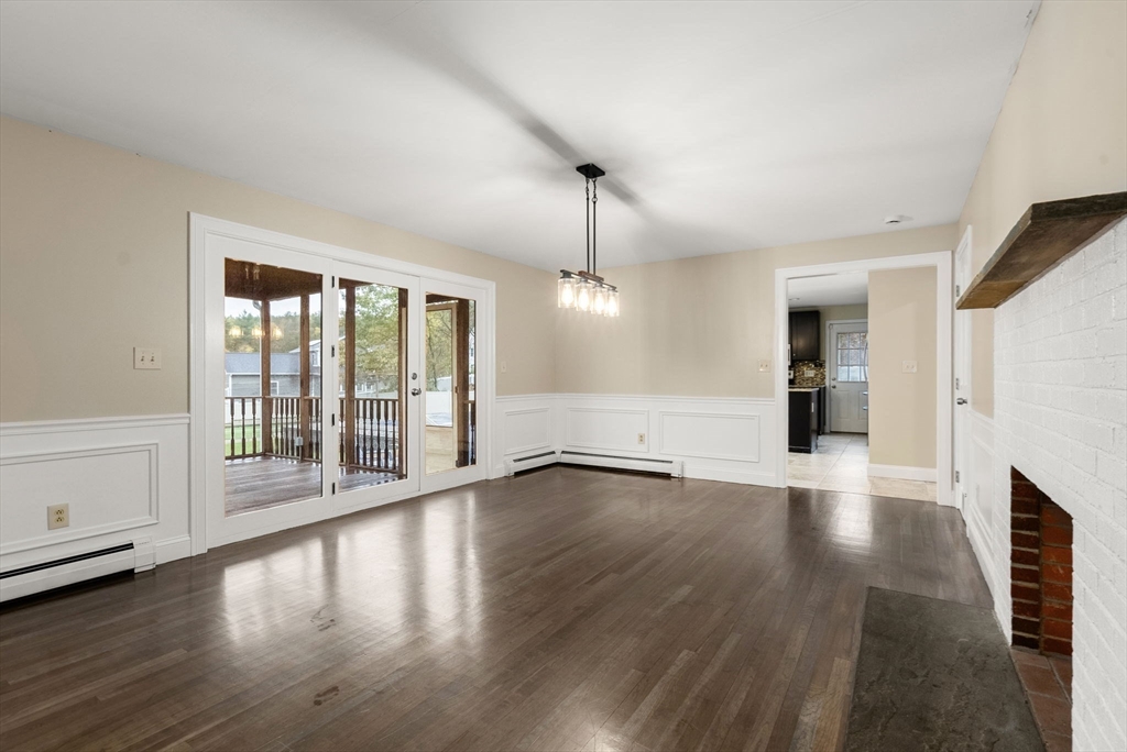 163 South Shelburne Road Greenfield, MA 01301 - Photo 7 of 36 an empty room with wooden floor and windows