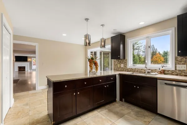 a kitchen with a sink and cabinets