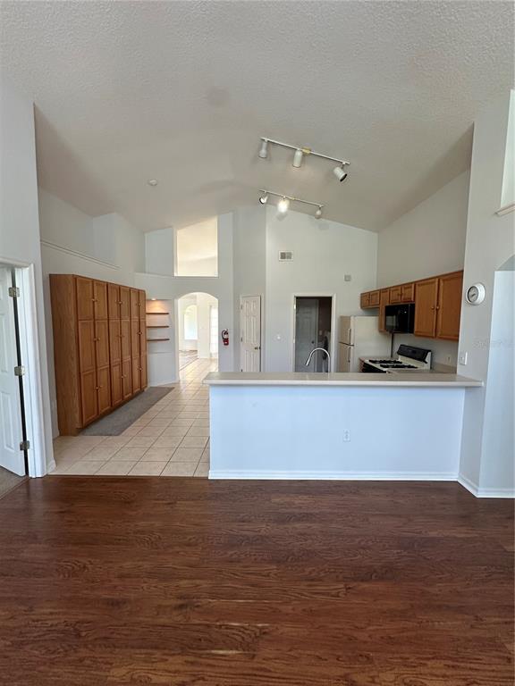 2823 Drifting Lilly Loop Kissimmee, FL 34747 - Photo 11 of 25 a view of kitchen with wooden floor