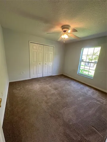a view of a house with backyard and porch