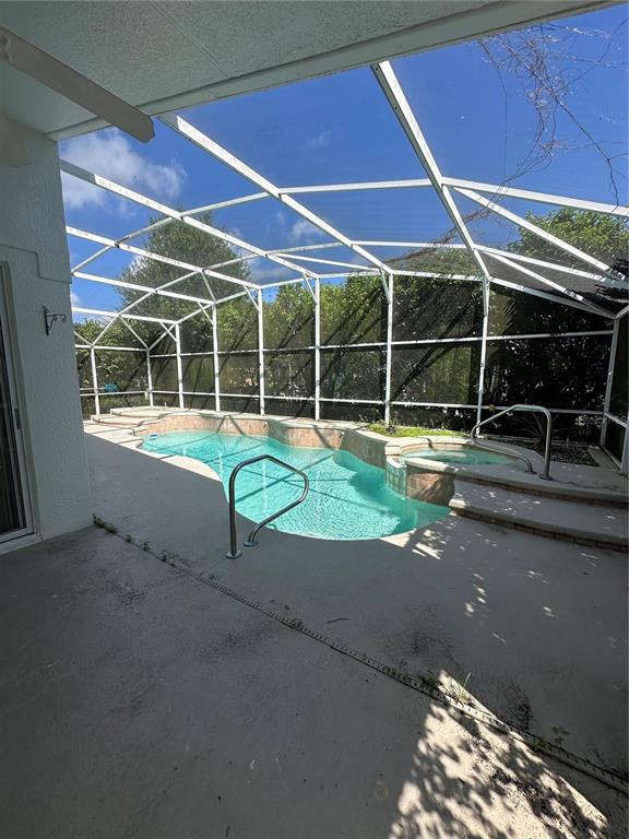 2823 Drifting Lilly Loop Kissimmee, FL 34747 - Photo 24 of 25 a view of a house with backyard and porch