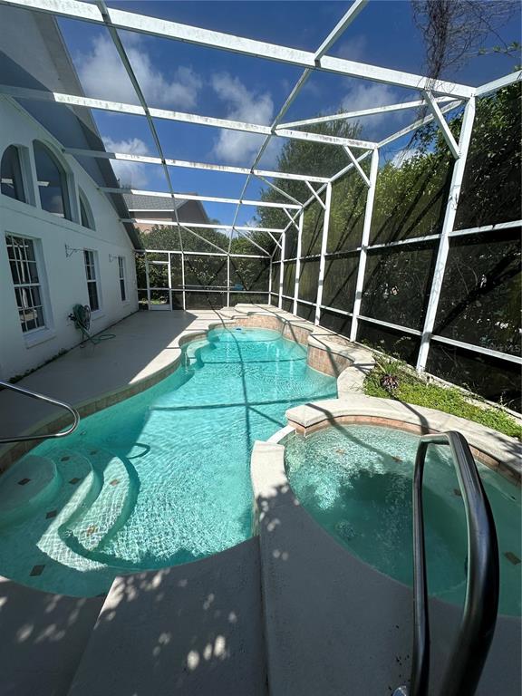 2823 Drifting Lilly Loop Kissimmee, FL 34747 - Photo 25 of 25 a house with trees in the background