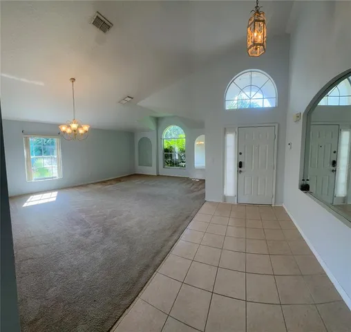 a view of an empty room and window