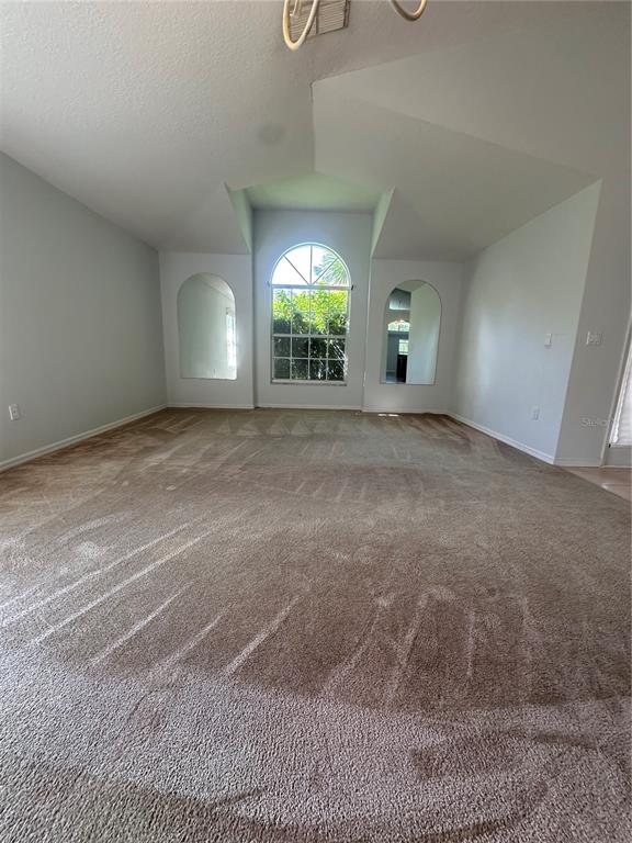 2823 Drifting Lilly Loop Kissimmee, FL 34747 - Photo 5 of 25 a view of a room with a window and wooden floor