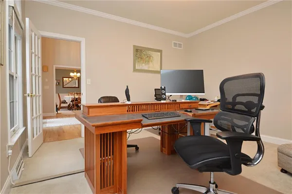 a view of a workspace with furniture