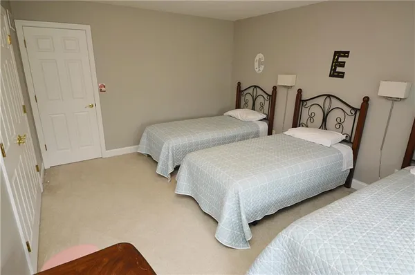 a bedroom with two beds and painted walls