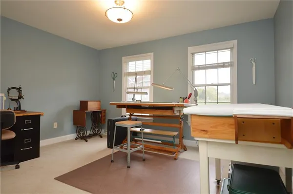 a room with a desk and a window