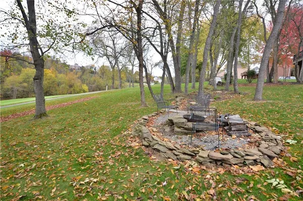 a view of outdoor space with trees all around