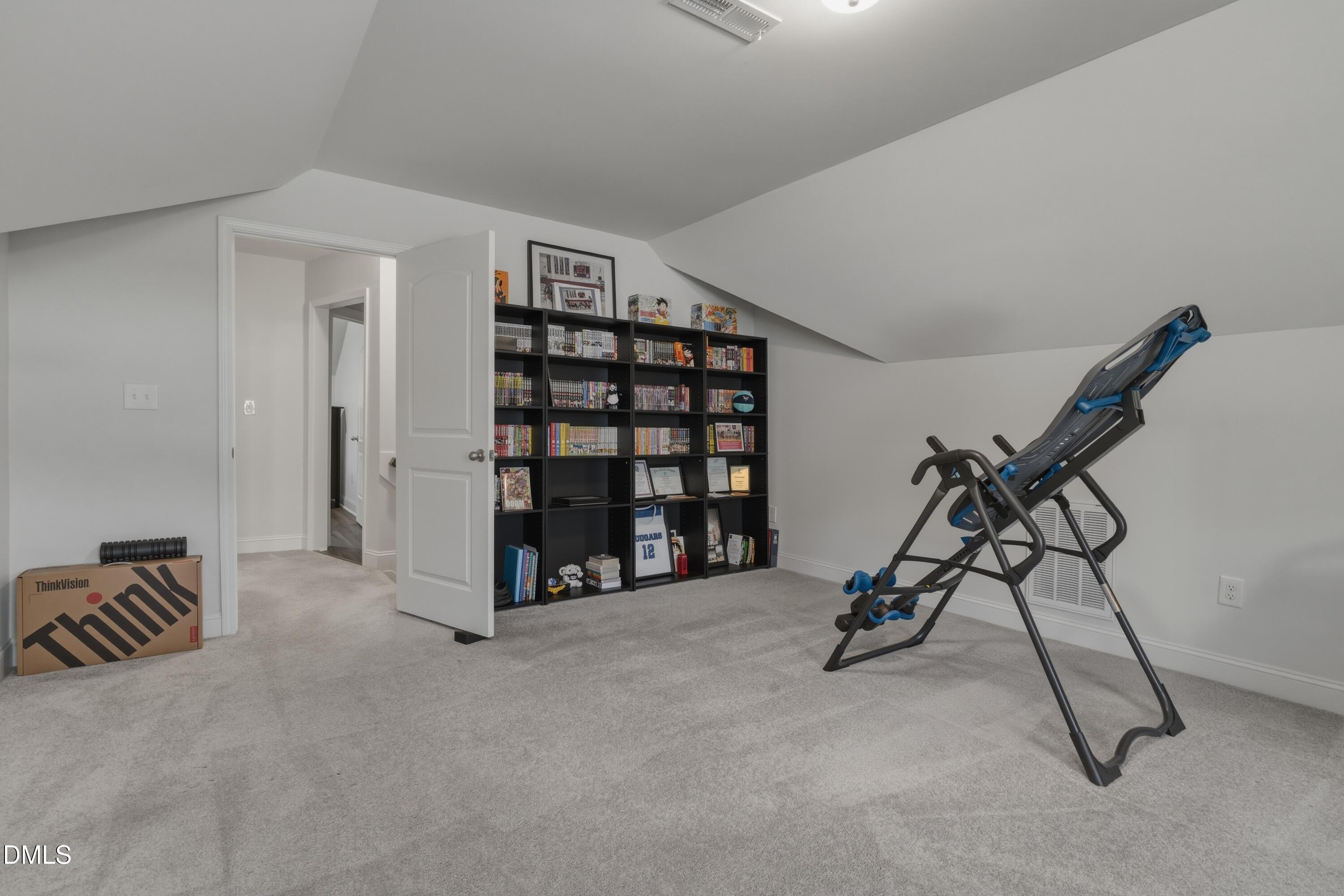 386 Howards Crossing Drive Wendell, NC 27591 - Photo 17 of 31 a view of a room with gym equipment