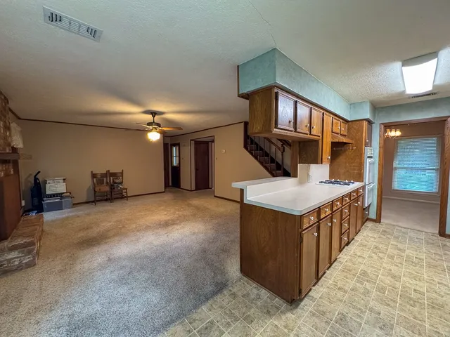 a kitchen with a stove and a sink