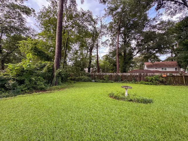 a backyard of a house with lots of green space