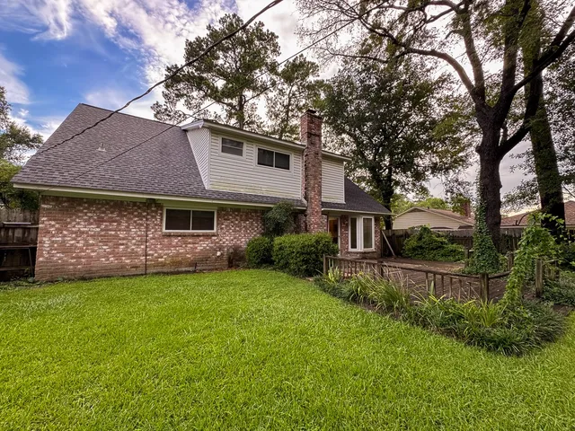 a view of a room with wooden walls and stairs