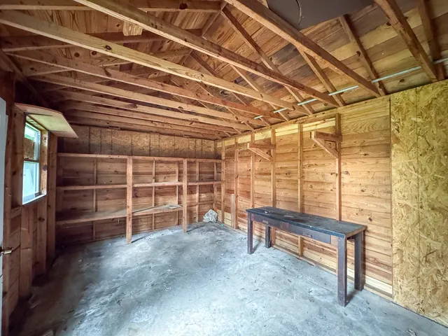 a view of porch with a sink and wooden fence