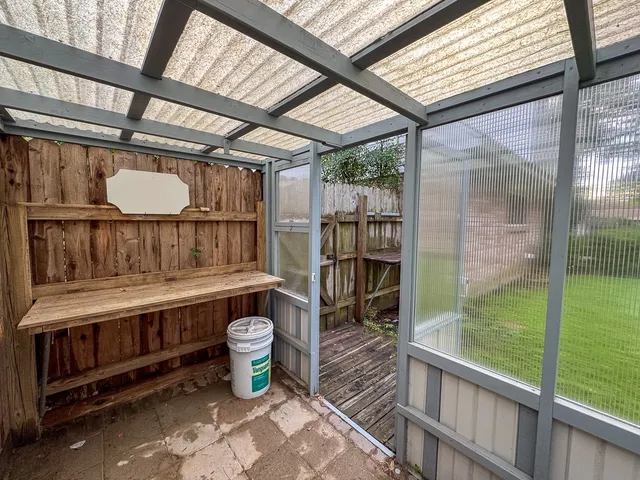 a view of a park with large trees