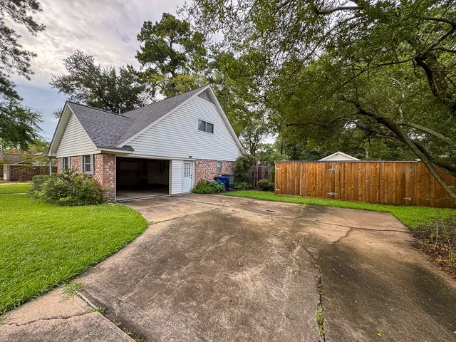 a front view of a house with a yard and a garage