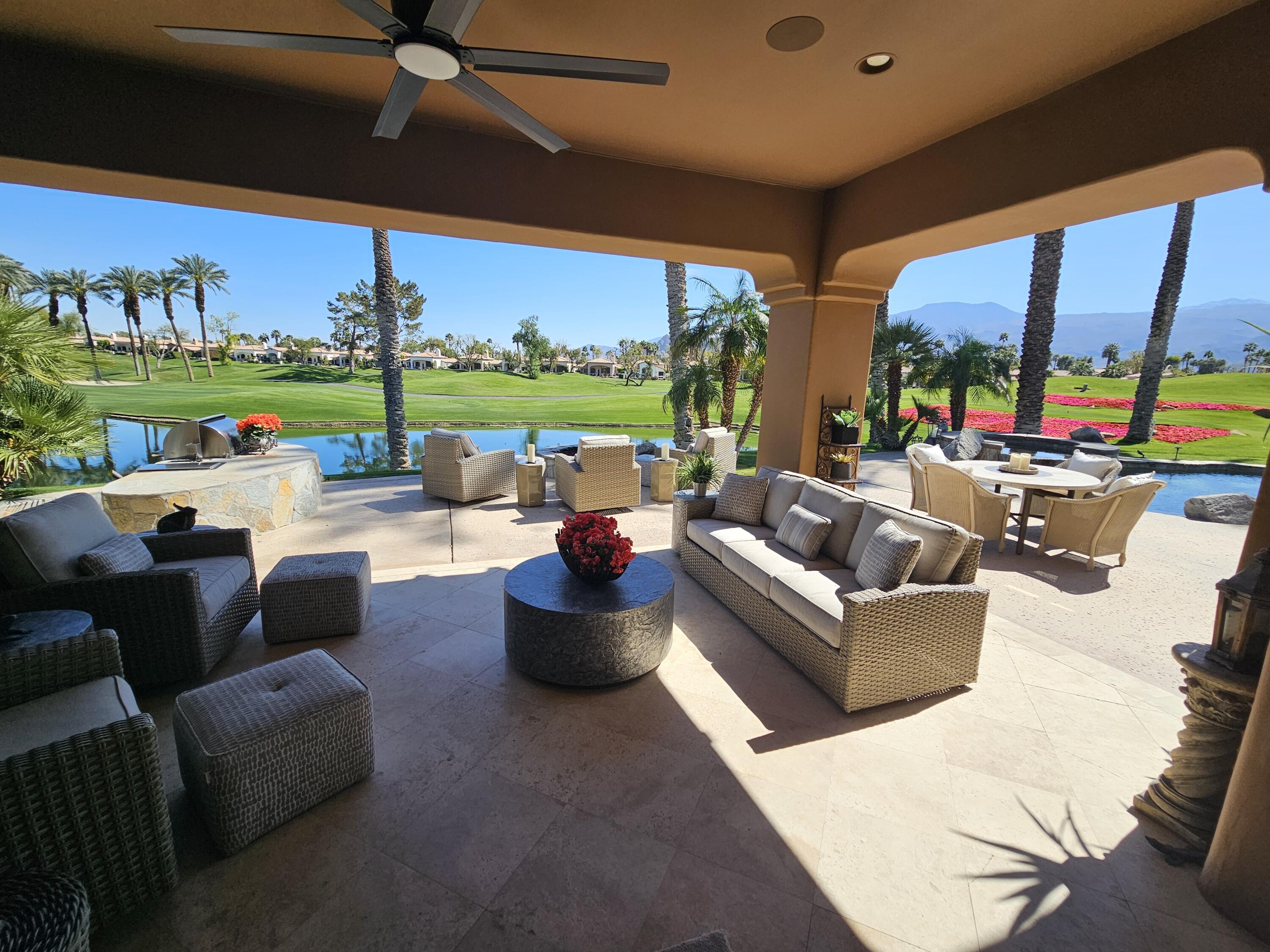 78815 Vía Carmel La Quinta, CA 92253 - Photo 12 of 74 a living room with patio furniture and a large window