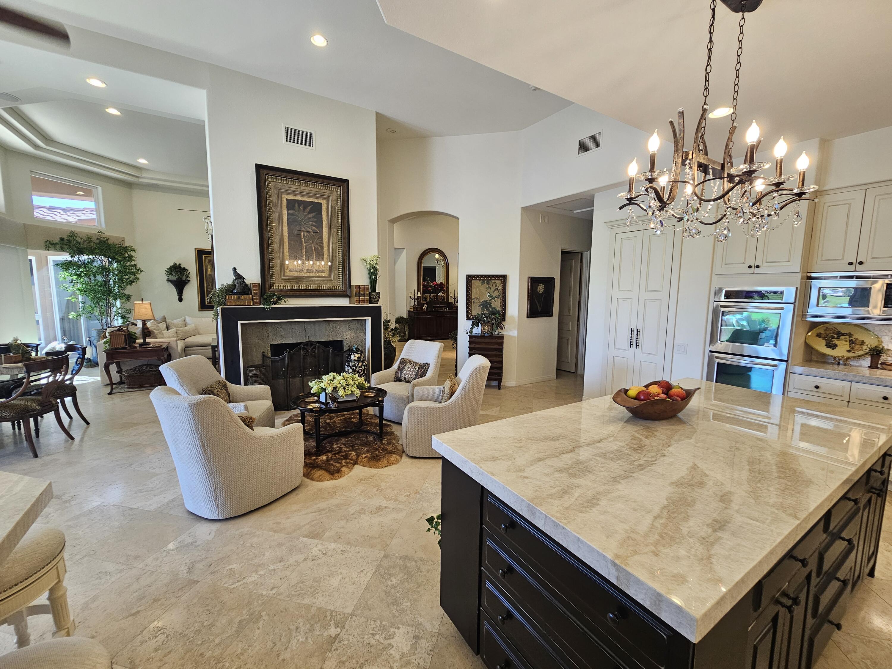 78815 Vía Carmel La Quinta, CA 92253 - Photo 18 of 74 a living room with furniture and a fireplace
