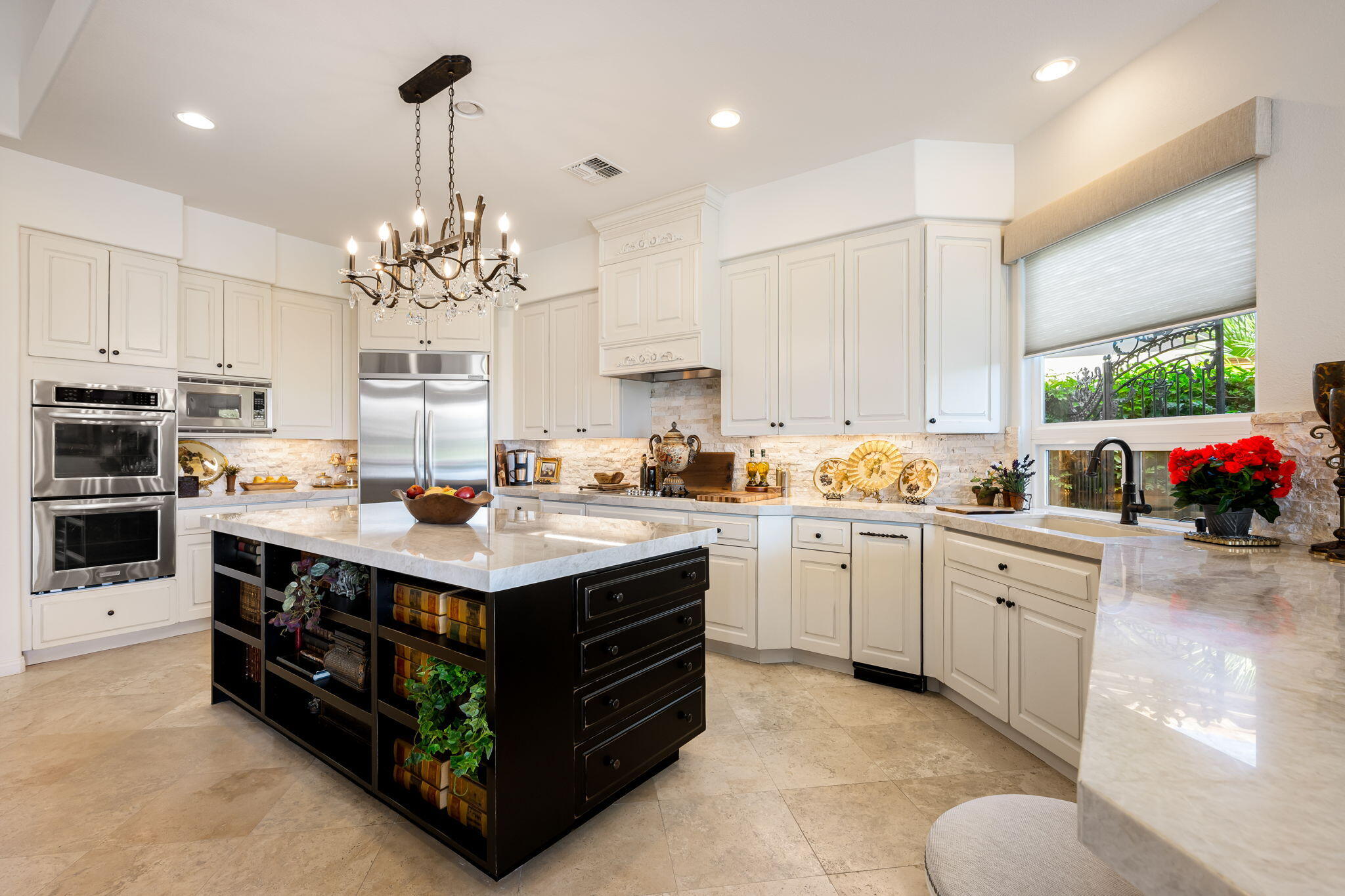 78815 Vía Carmel La Quinta, CA 92253 - Photo 24 of 74 a kitchen with stainless steel appliances granite countertop a stove a sink dishwasher and white cabinets with wooden floor