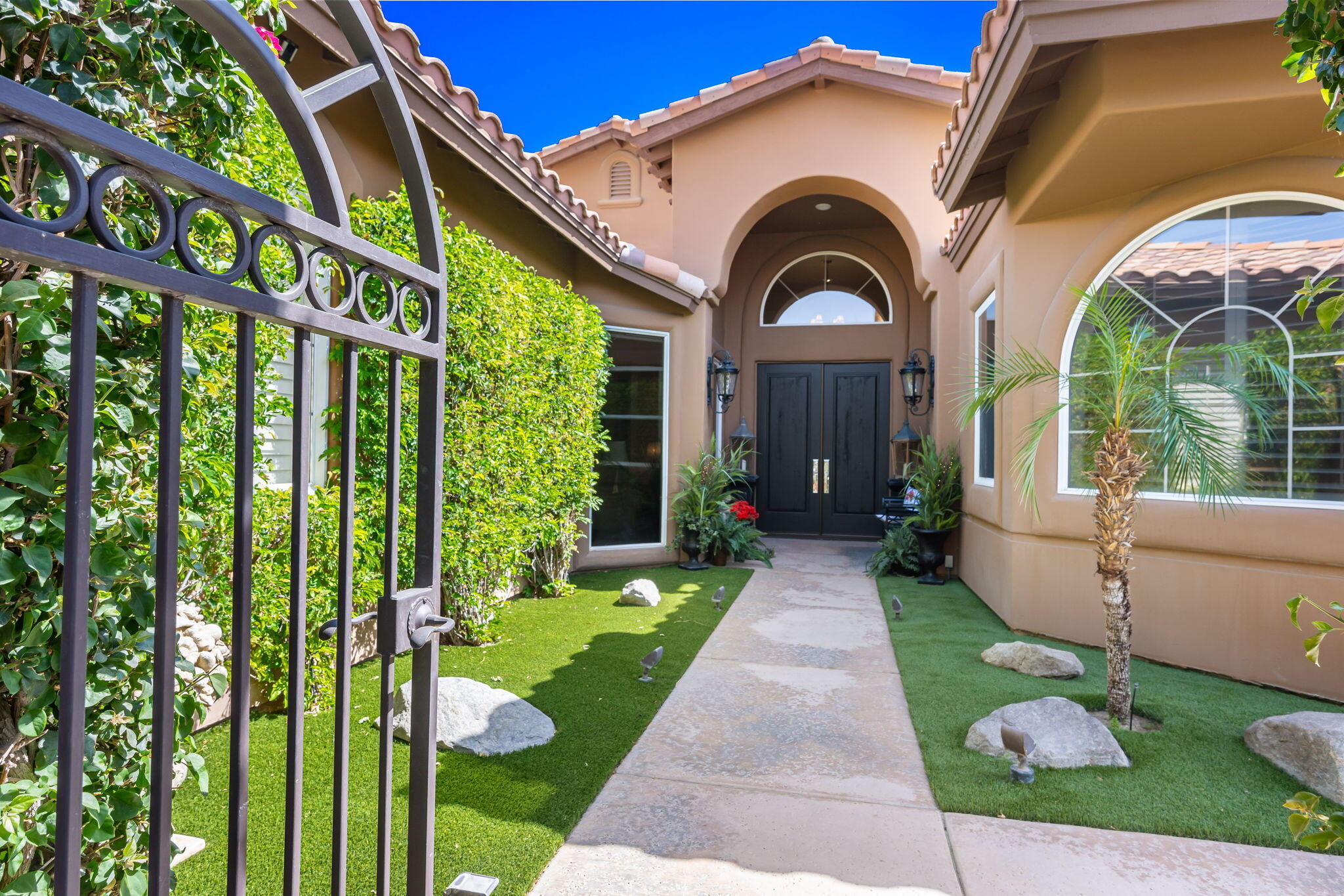 78815 Vía Carmel La Quinta, CA 92253 - Photo 46 of 74 a front view of a house with a yard