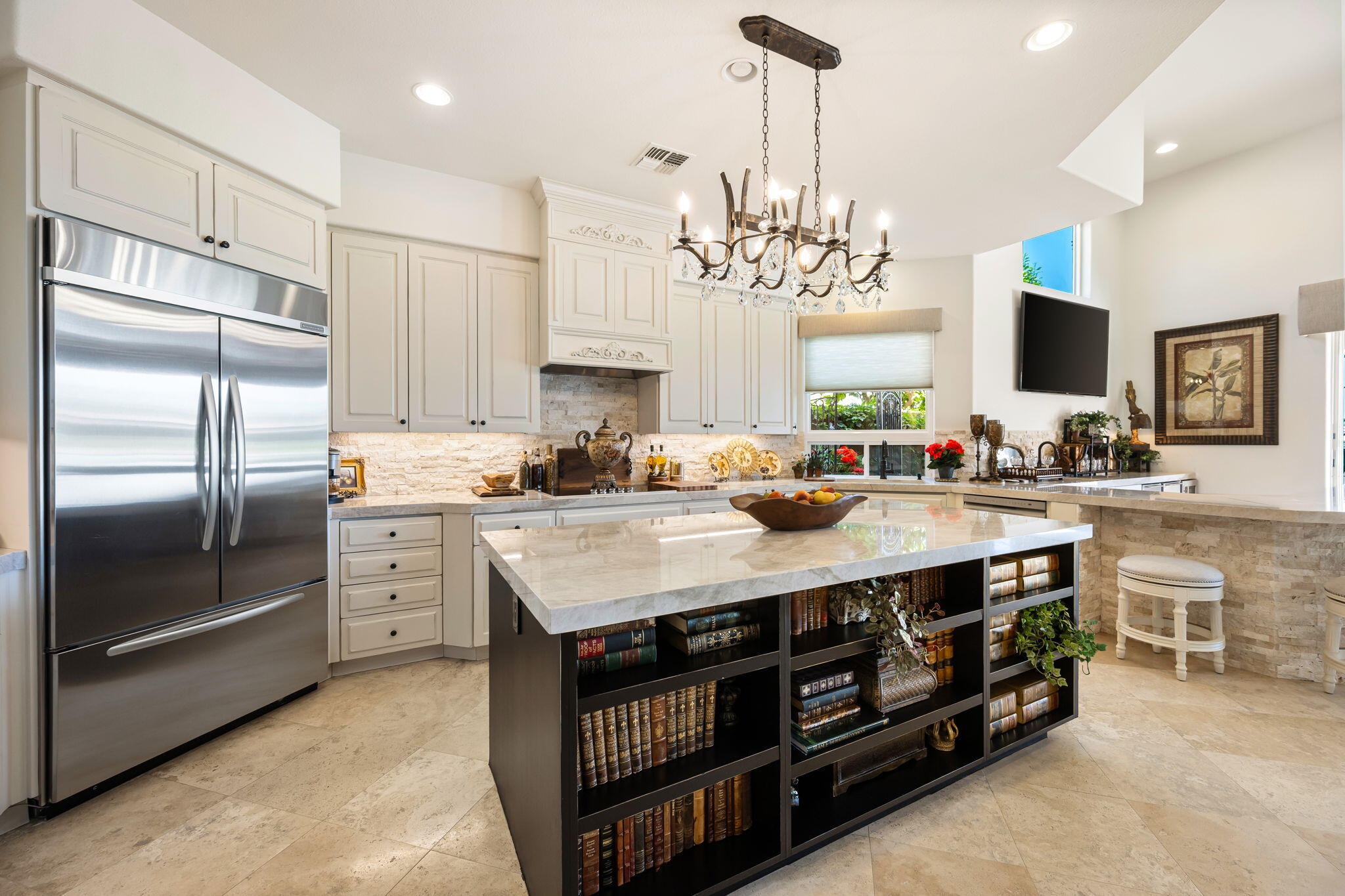 78815 Vía Carmel La Quinta, CA 92253 - Photo 52 of 74 a kitchen with stainless steel appliances a sink a stove a refrigerator cabinets and chairs