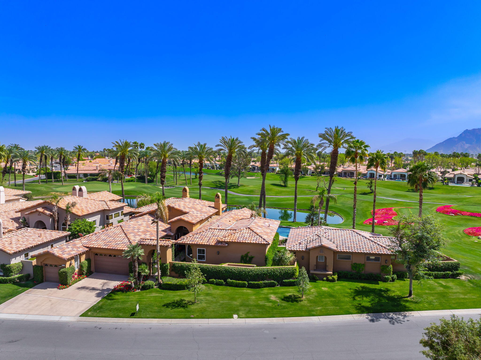78815 Vía Carmel La Quinta, CA 92253 - Photo 7 of 74 a view of yard with swimming pool and green space