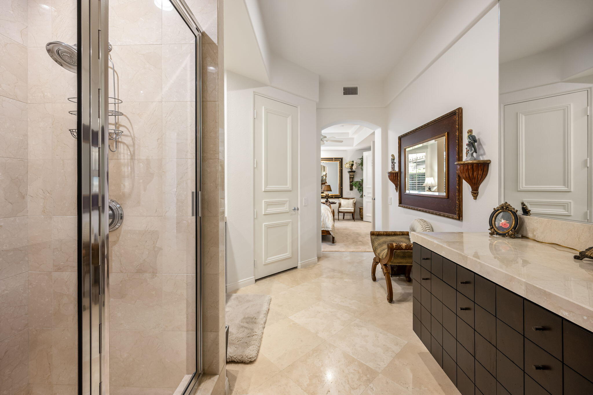 78815 Vía Carmel La Quinta, CA 92253 - Photo 71 of 74 a spacious bathroom with a granite countertop sink mirror and a shower