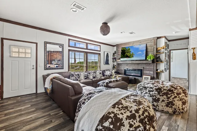 a open kitchen with stainless steel appliances granite countertop a stove and refrigerator