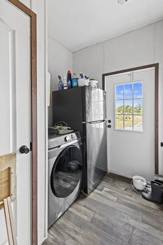 a view of a lake with table and chairs