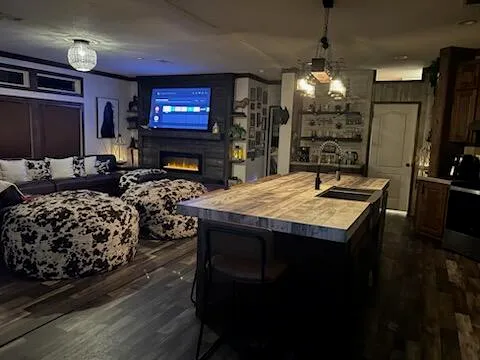 a spacious bedroom with a bed and a large mirror