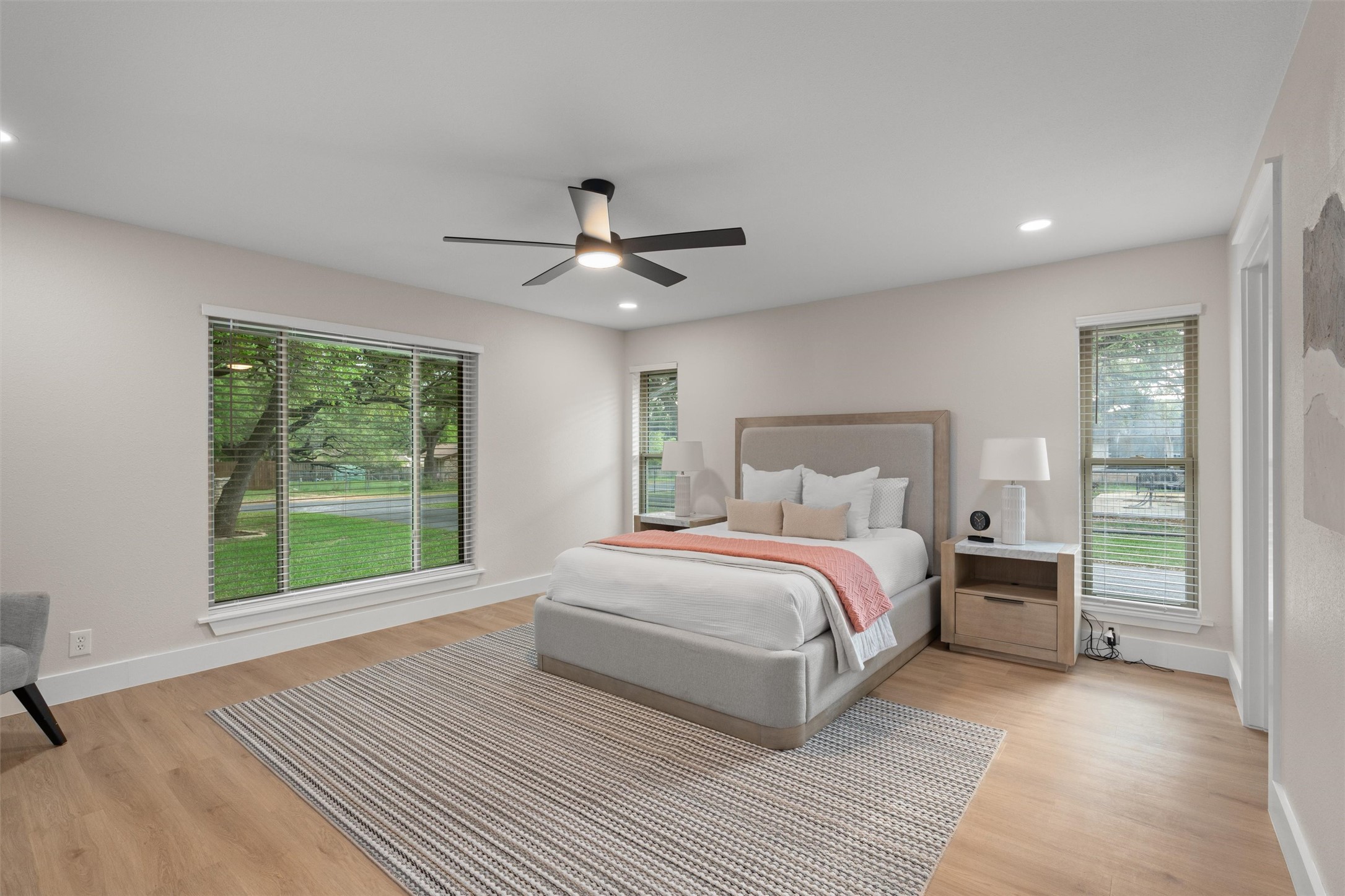 224 Clear Spring Road Georgetown, TX 78628 - Photo 21 of 40 a spacious bedroom with a large bed and a large window
