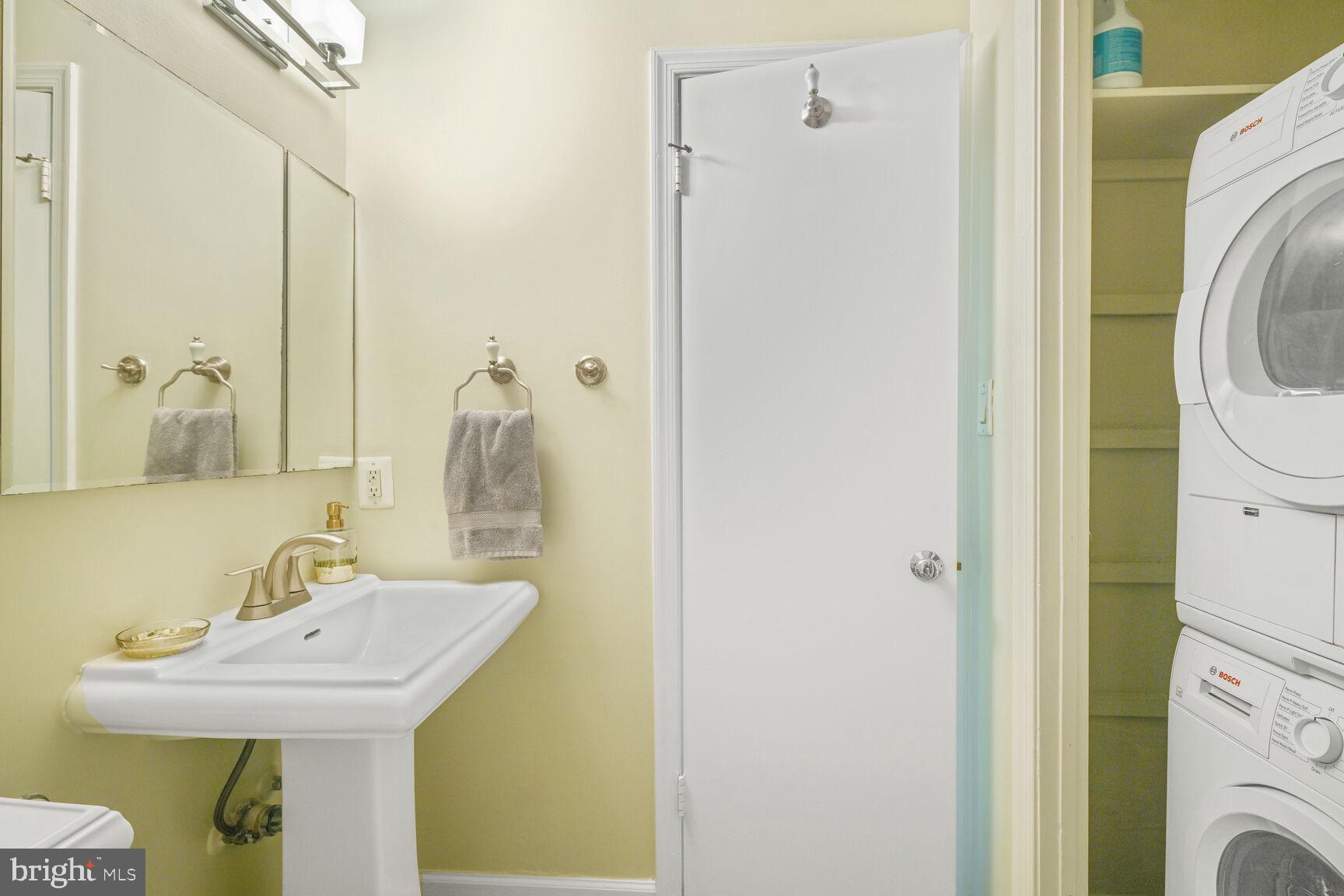 2001 16th Street Northwest, Unit 203 Washington, DC 20009 - Photo 12 of 15 a bathroom with a sink a mirror and shower