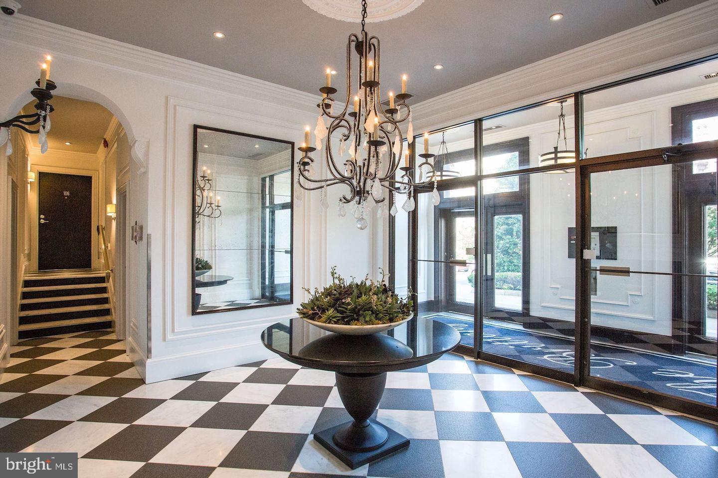2001 16th Street Northwest, Unit 203 Washington, DC 20009 - Photo 14 of 15 a room with a chandelier and furniture