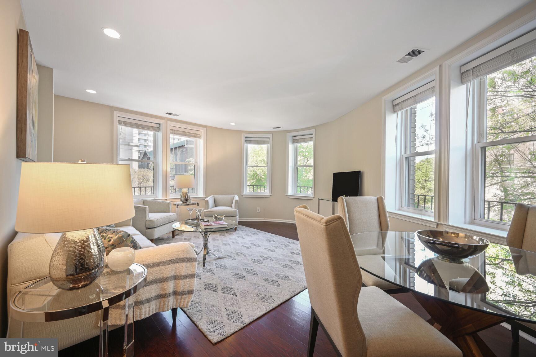 2001 16th Street Northwest, Unit 203 Washington, DC 20009 - Photo 4 of 15 a living room with furniture and large windows