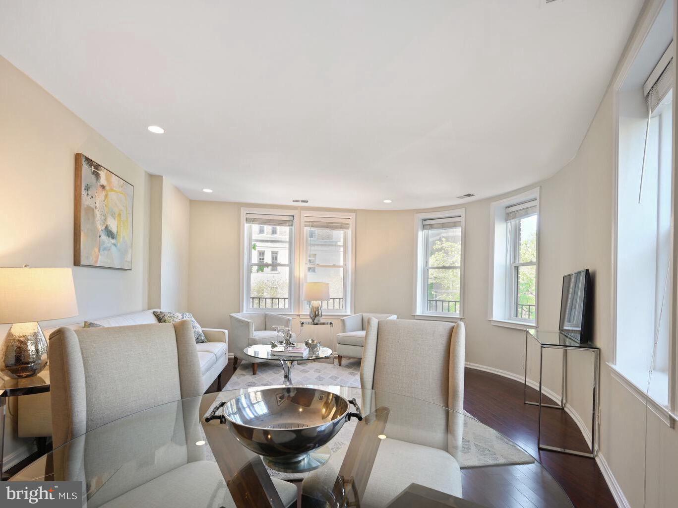 2001 16th Street Northwest, Unit 203 Washington, DC 20009 - Photo 5 of 15 a view of a dining room with furniture window and wooden floor